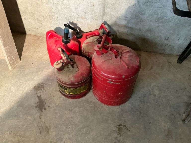 5 gas cans, plastic and metal image