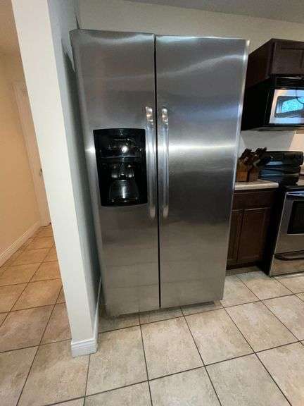 Frigidaire side by side refrigerator, 26 cu. ft., water and ice in the door, 68 1/2" T x 36" W x 31 3/4" D image