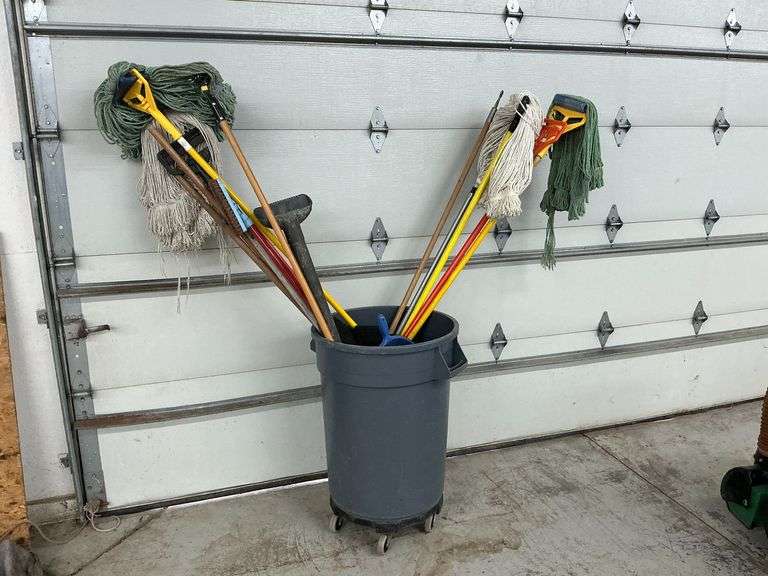 Plastic rolling trash can, assorted rag mops, buffer pads, etc. image
