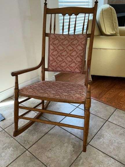 Antique rocker with upholstered seat and back image