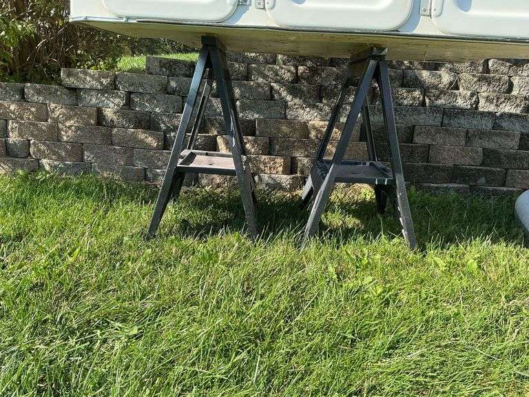 2 plastic saw horses. image