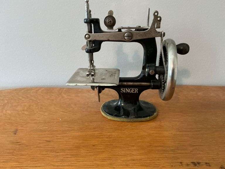 Antique Singer children's sewing machine. image