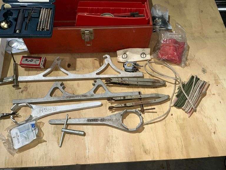 Metal tool box with small engine tools image