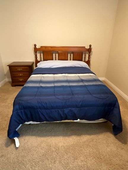 Full size bedframe with linens, mattress and box springs image