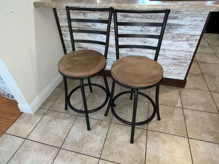 Pair of metal swivel bar stools with upholstered seats image