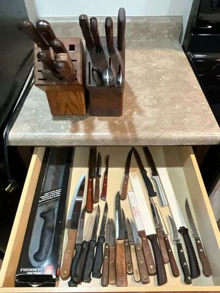 Assortment of knives and pair of knife blocks image