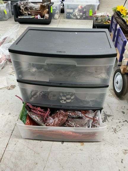 3-drawer storage container with assortment of Mardi Gras and Halloween decorations image