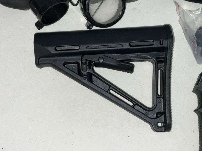 Scope covers, grips, MAG pull grip and part of stock butt