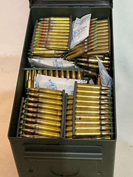 Metal ammo can with 1000 +/- rounds of 5.56 green tips on zipper clips.