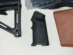 Scope covers, grips, MAG pull grip and part of stock butt