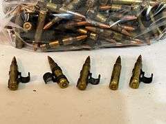 Military ammo 5.56, orange tips, 250 rounds +/-.