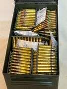 Metal ammo can with 1000 +/- rounds of 5.56 green tips on zipper clips.