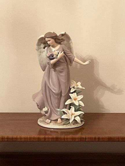 Angel with lilies and roses statue