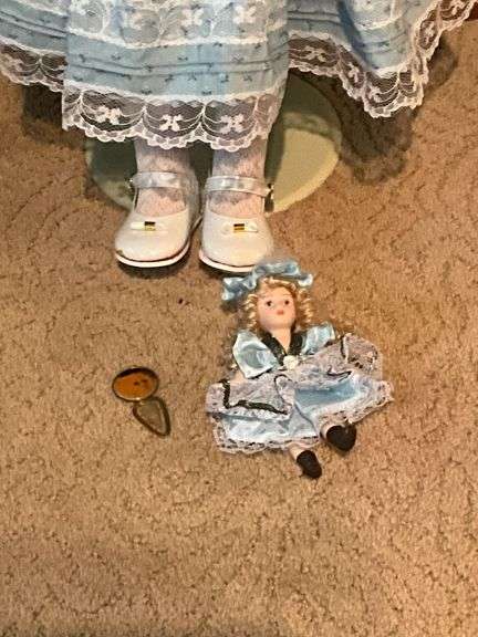 Porcelain doll on stand, 24" T