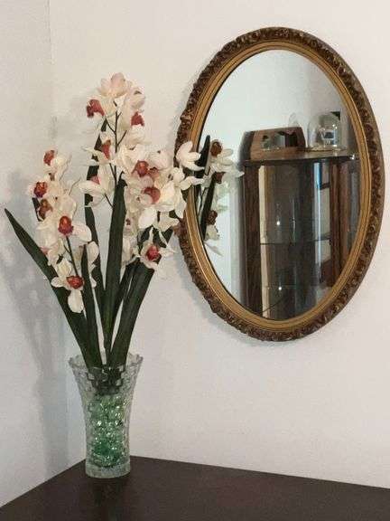 Oval ornate framed mirror, 27" x 18 1/2"