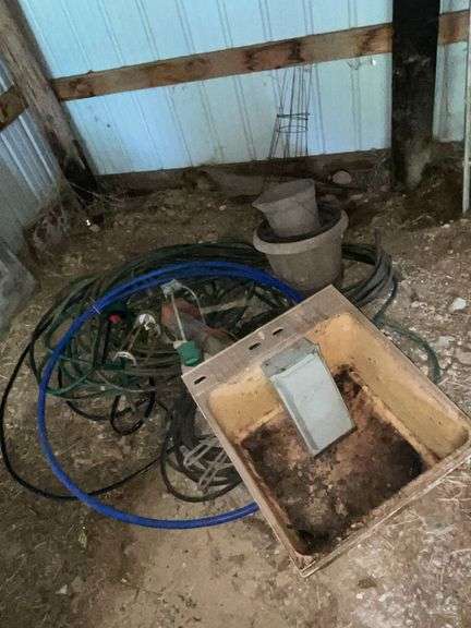 Garden hoses, lawn sprinklers, stock tank heater image