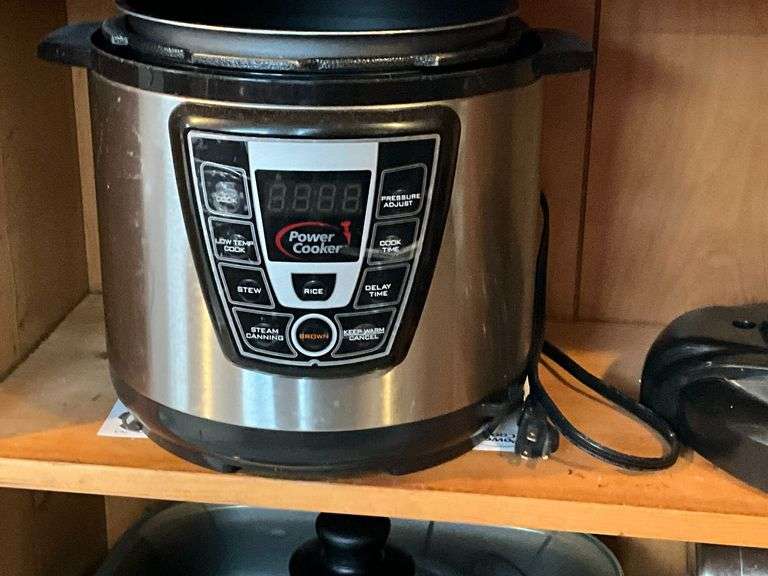Power Cooker InstaPot with lid and instructions image