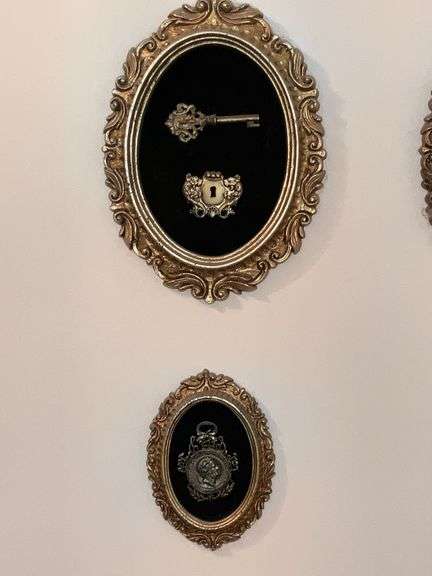 Framed plastic keys, padlock, etc.