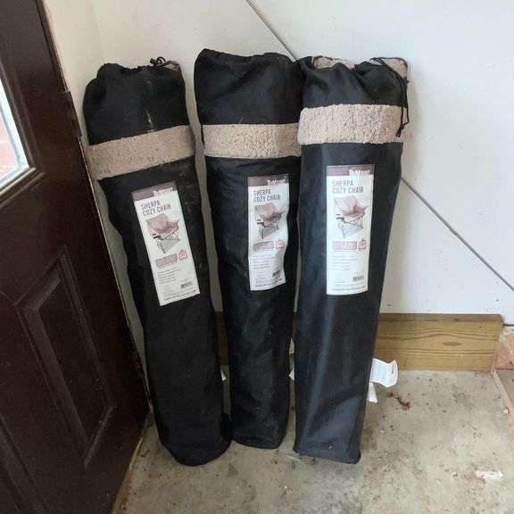 Three sherpa cozy chairs in bags