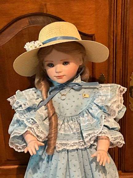Porcelain doll on stand, 24" T