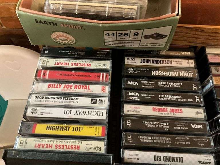 Assortment of music cassettes and CDs