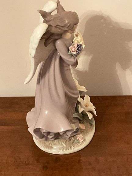 Angel with lilies and roses statue