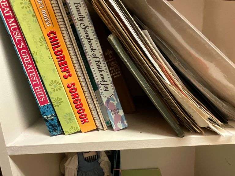 Assortment of sheet music and music books