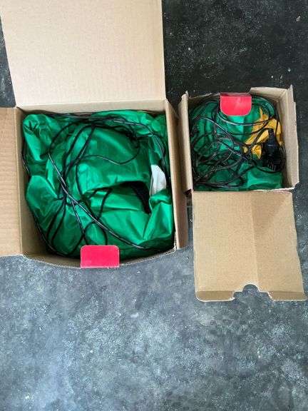 Pair of Holiday Time inflatable Christmas trees up to 7' T