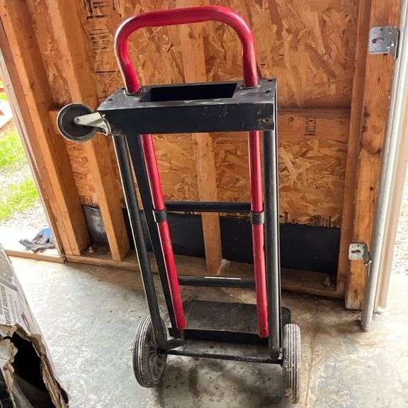 Two-wheel hand truck, missing a wheel