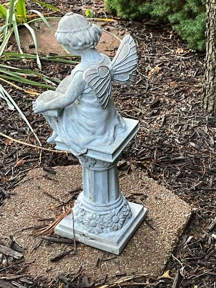 Fairy reading on a column