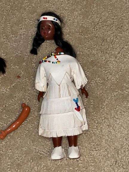 Pair of Indian dolls, with real leather dresses
