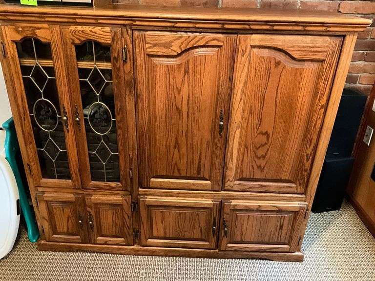 Wood entertainment center with electronics image