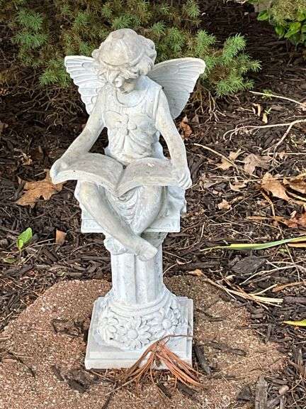 Fairy reading on a column