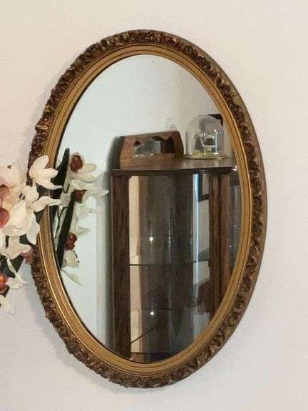 Oval ornate framed mirror, 27" x 18 1/2"