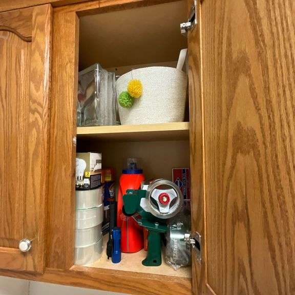 Contents of laundry room, cleaning supplies, light bulbs, ironing board