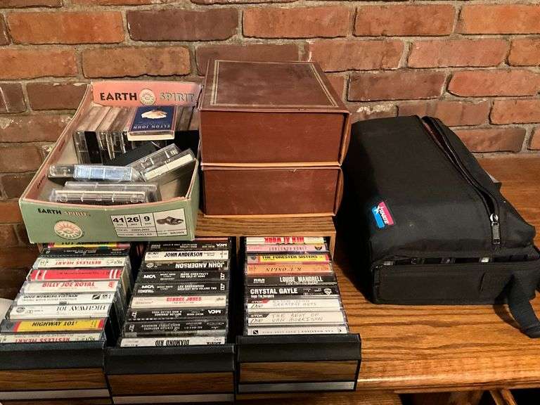 Assortment of music cassettes and CDs image