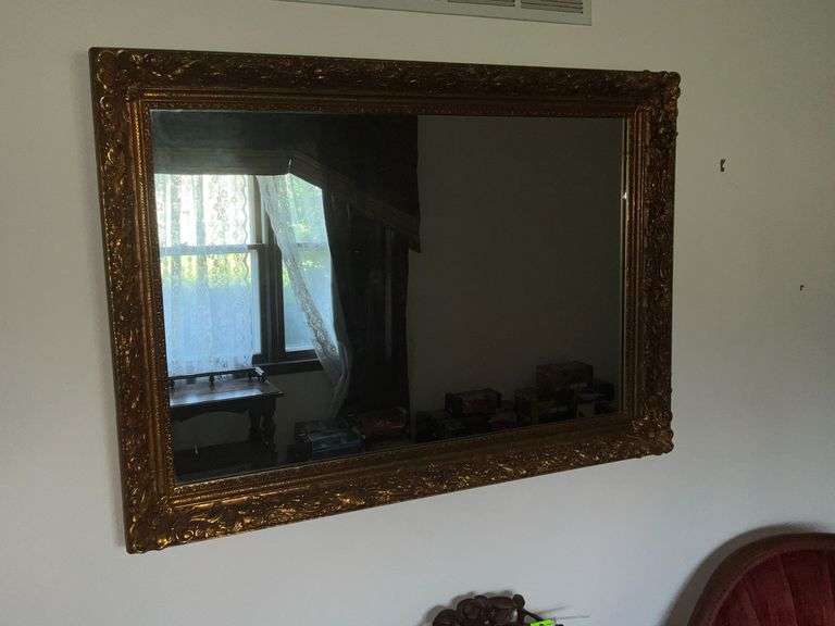 Ornate framed mirror image