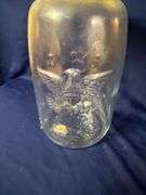 Mason's large glass jar with bail handle, cracked plastic lid