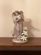 Angel with lilies and roses statue