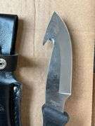 Remington skinning knife, 4" blade and leather sheath