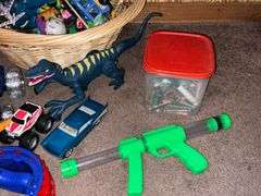 Assortment of toys, Nerf guns, cars, trucks