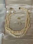 Triple strand of pearls with 14K gold clasp