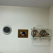 Contents of laundry room, cleaning supplies, light bulbs, ironing board