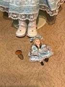 Porcelain doll on stand, 24" T