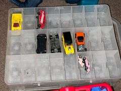 Assortment of toys, Nerf guns, cars, trucks