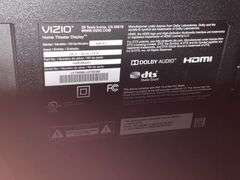 Vizio flatscreen Smart TV with remote and stand