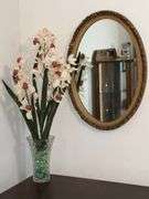 Oval ornate framed mirror, 27" x 18 1/2"