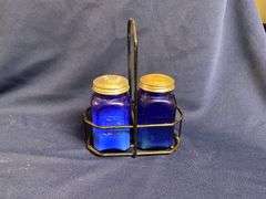 Cobalt blue salt & pepper shakers in wire caddy