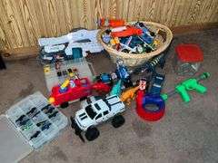 Assortment of toys, Nerf guns, cars, trucks