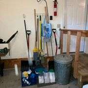 Snow shovel, rake, mop, yard sticks, trash bags, ice melt, galvanized trash can, fire extinguisher